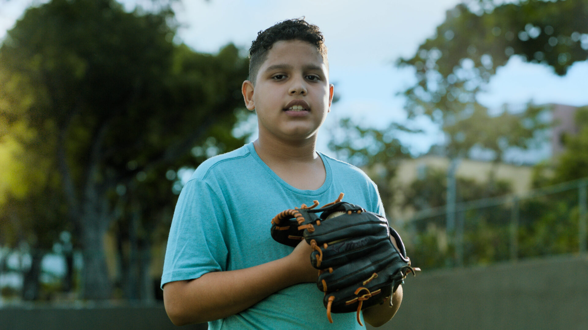Boy plays baseball