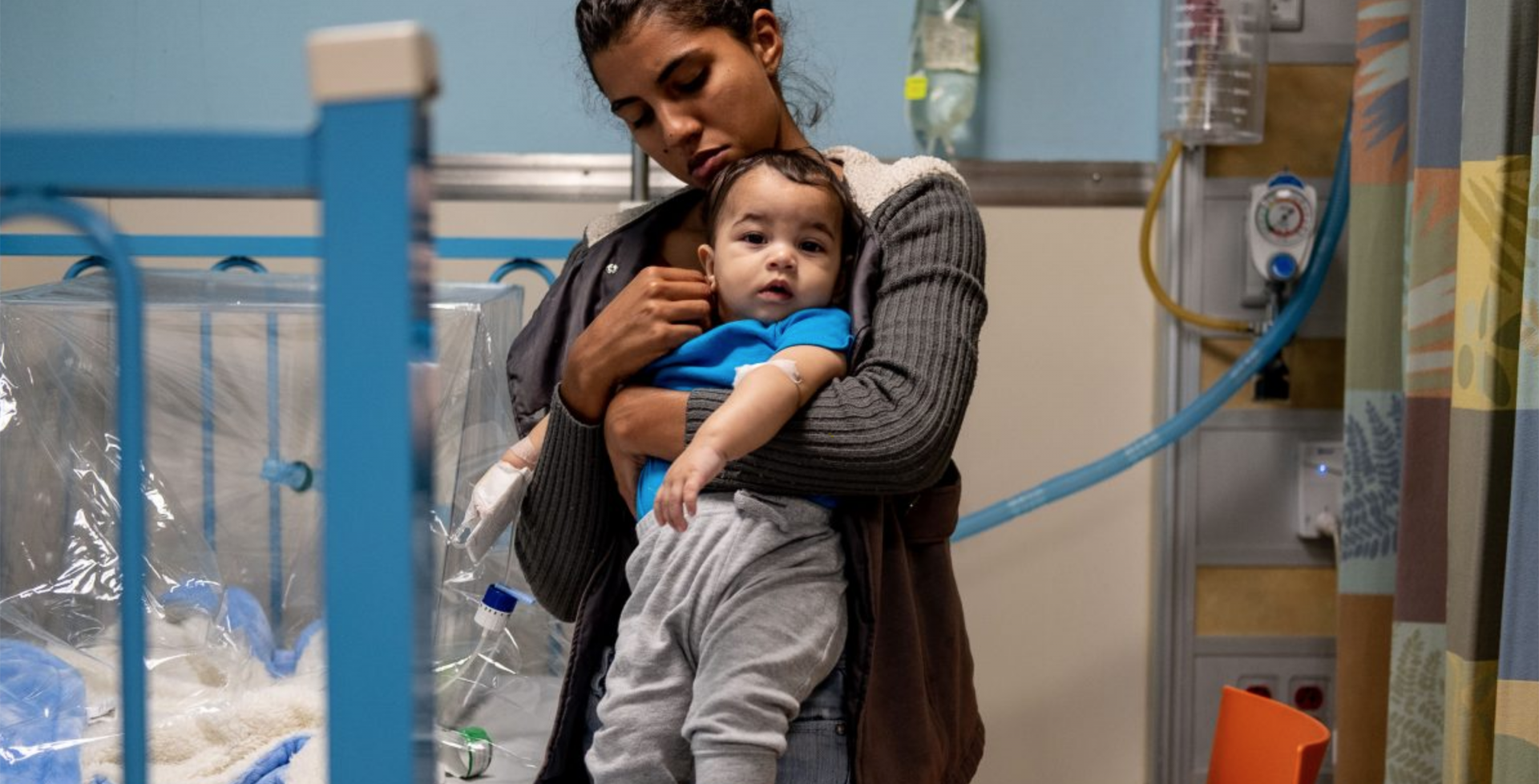 Nurse holding baby boy Nurse holding baby boy